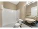 Bathroom featuring a combination tub and shower, a stone vessel sink and plenty of natural light at 240 Indian Creek Rd, Locust Grove, GA 30248