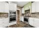 Well-equipped kitchen with stainless steel appliances and light countertops at 240 Indian Creek Rd, Locust Grove, GA 30248