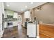Open-concept kitchen featuring custom cabinets, granite countertops, and an island, ideal for modern living and entertaining at 240 Indian Creek Rd, Locust Grove, GA 30248