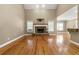 Bright living room showcasing a stone fireplace and hardwood floors at 240 Indian Creek Rd, Locust Grove, GA 30248