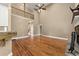 Bright living room showcasing a fireplace and wood floors at 240 Indian Creek Rd, Locust Grove, GA 30248