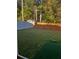 Spacious backyard with a mix of grass and ground cover surrounded by a white and wooden fence at 5009 Duval Point Sw Way, Snellville, GA 30039