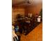 Finished basement with tile floor, game tables, beverage cooler, and orange painted walls at 5009 Duval Point Sw Way, Snellville, GA 30039