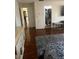 Bedroom featuring hardwood floors, a walk-in closet and bright windows at 5009 Duval Point Sw Way, Snellville, GA 30039