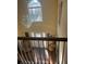 Bright foyer featuring a modern chandelier, high ceilings, and a large window that floods the space with natural light at 5009 Duval Point Sw Way, Snellville, GA 30039
