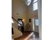 Bright foyer featuring a modern chandelier, high ceilings, and a large window that floods the space with natural light at 5009 Duval Point Sw Way, Snellville, GA 30039