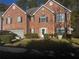 Charming two-story brick home with an attached garage and manicured landscaping creating an inviting curb appeal at 5009 Duval Point Sw Way, Snellville, GA 30039
