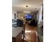 Open concept living room and kitchen with hardwood floors, recessed lighting, and modern furniture at 5009 Duval Point Sw Way, Snellville, GA 30039