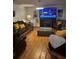 Cozy living room featuring hardwood floors, recessed lighting, comfortable furniture, and neutral decor at 5009 Duval Point Sw Way, Snellville, GA 30039