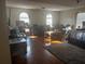 Sun-filled main bedroom featuring hardwood floors, sitting area, and views from the bright windows at 5009 Duval Point Sw Way, Snellville, GA 30039