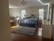 Spacious main bedroom suite with hardwood floors, sitting area and natural light from large windows at 5009 Duval Point Sw Way, Snellville, GA 30039