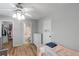 Cozy bedroom with wood floors offers a door to the bathroom and closet at 6810-G Glenridge Dr, Atlanta, GA 30328