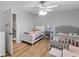 Charming bedroom featuring two beds, modern wood floors, and a neutral color palette at 6810-G Glenridge Dr, Atlanta, GA 30328