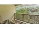 This cozy deck is accented by a lattice railing and offers picturesque green views at 6810-G Glenridge Dr, Atlanta, GA 30328