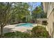 A luxurious pool with a large deck provides a peaceful outdoor space at 6810-G Glenridge Dr, Atlanta, GA 30328