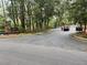 Scenic view of neighborhood entrance featuring brick signage and landscaped surroundings at 6810-G Glenridge Dr, Atlanta, GA 30328