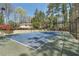 A well-maintained tennis court for sports and recreation is fenced and beautifully lined at 6810-G Glenridge Dr, Atlanta, GA 30328