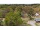 Aerial view of a landscaped property with mature trees, offering privacy and natural beauty at 6957 Mason Creek Rd, Douglasville, GA 30135