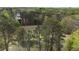 Aerial view of wooded acreage with an expansive cleared area, perfect for building or recreation at 6957 Mason Creek Rd, Douglasville, GA 30135