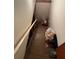 Stairwell to basement with wooden steps at 6957 Mason Creek Rd, Douglasville, GA 30135