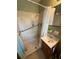 Cozy bathroom featuring a shower with glass enclosure and vanity at 6957 Mason Creek Rd, Douglasville, GA 30135