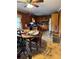 Dining room featuring wood paneling, a ceiling fan, and tiled floors at 6957 Mason Creek Rd, Douglasville, GA 30135
