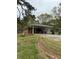 Brick home featuring a large backyard at 6957 Mason Creek Rd, Douglasville, GA 30135
