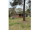 Side view of brick home with a carport and grass yard at 6957 Mason Creek Rd, Douglasville, GA 30135