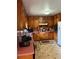 Charming kitchen features knotty pine cabinetry and a pink countertop at 6957 Mason Creek Rd, Douglasville, GA 30135