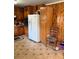 The kitchen shows ample cabinet storage and modern white refrigerator at 6957 Mason Creek Rd, Douglasville, GA 30135