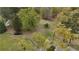 Aerial view of the land showcasing its generous size and surrounding lush trees. Pick-up truck parked on property at 6957 Mason Creek Rd, Douglasville, GA 30135