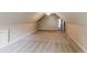 Large bonus room with neutral walls, carpeted floors, and access door at 1209 Richmond Rdg, Loganville, GA 30052