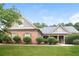 Charming home featuring a well-manicured lawn and beautiful landscaping under a bright sky at 1209 Richmond Rdg, Loganville, GA 30052