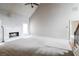Spacious living room features a fireplace, neutral carpet, and light gray walls at 1209 Richmond Rdg, Loganville, GA 30052