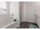 Bathroom features a soaking tub with tile flooring and a glass enclosed shower at 121 Shoals Bridge Rd, Acworth, GA 30102