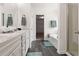 Bathroom with double sink vanity, garden tub, shower, and tile floors at 121 Shoals Bridge Rd, Acworth, GA 30102