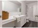 Bathroom featuring a vanity with white countertops and dark tile flooring at 121 Shoals Bridge Rd, Acworth, GA 30102