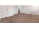 Neutral bedroom with carpeting, white walls, and doors at 121 Shoals Bridge Rd, Acworth, GA 30102