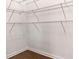 Walk-in closet with built-in shelving and wood flooring at 121 Shoals Bridge Rd, Acworth, GA 30102