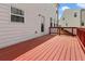 This home features a stained wooden deck with a classic railing at 121 Shoals Bridge Rd, Acworth, GA 30102