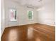 Open dining area with hardwood flooring, natural light, and a modern chandelier at 121 Shoals Bridge Rd, Acworth, GA 30102