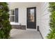Close-up of the front door with decorative stone accents and sidelight window at 121 Shoals Bridge Rd, Acworth, GA 30102