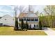 Charming two-story home with manicured front yard and black shuttered windows at 121 Shoals Bridge Rd, Acworth, GA 30102