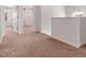 Upstairs hallway with carpet flooring and multiple bedrooms at 121 Shoals Bridge Rd, Acworth, GA 30102