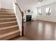 Bright living room with hardwood floors, fireplace, ceiling fan and staircase at 121 Shoals Bridge Rd, Acworth, GA 30102