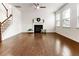 Bright living room with hardwood floors, fireplace, ceiling fan and staircase at 121 Shoals Bridge Rd, Acworth, GA 30102