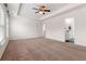 Spacious main bedroom features a tray ceiling, ceiling fan, and ensuite bathroom at 121 Shoals Bridge Rd, Acworth, GA 30102