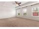 Bright and airy main bedroom with three windows and plush carpeting at 121 Shoals Bridge Rd, Acworth, GA 30102