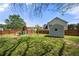 Backyard featuring a shed and a wooden play structure, enclosed by a wooden fence at 2232 Ann Ln, Lithia Springs, GA 30122