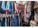 Well-organized walk-in closet offers ample storage for clothes and accessories at 2232 Ann Ln, Lithia Springs, GA 30122